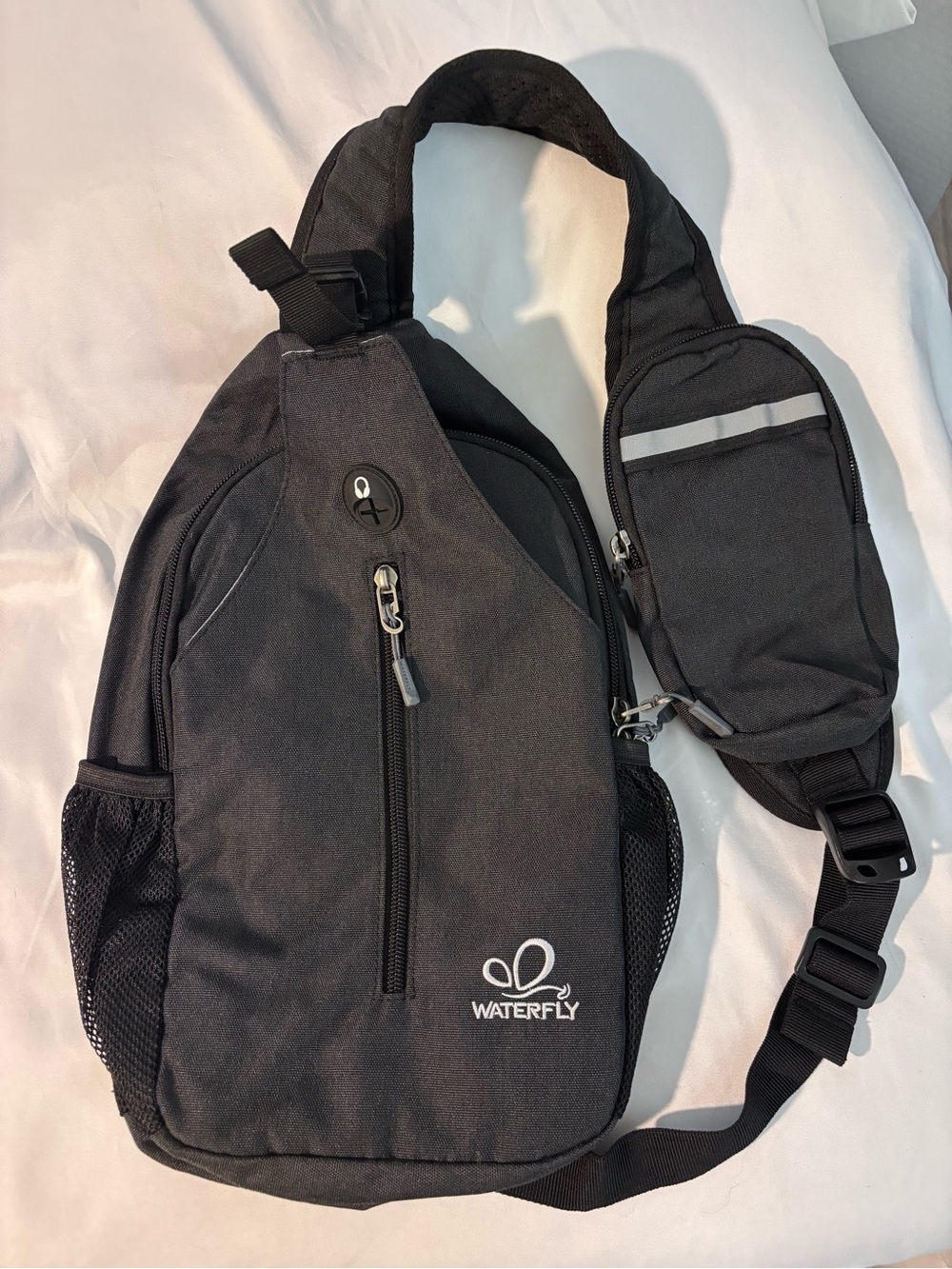 Waterfly Black Sling Backpack Crossbody Travel Bag Side Elastic Mesh Pockets
